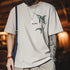 Person wearing a beige t-shirt with a fish graphic and 'Eclipse' branding, standing against a blurred indoor background.